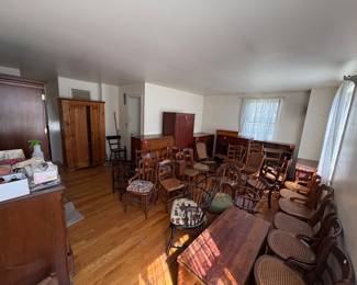 Upstairs bedroom has lots of beautiful solid wood chairs, dressers and cabinets!