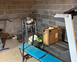 Workout equipment weight bench and treadmill located in basement
