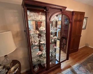 Curio cabinet with sliding door