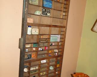 Racks filled with vintage tins and smalls