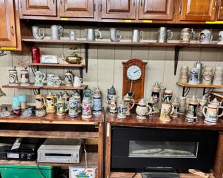 Beer steins, electric fireplace