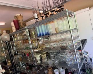 Shelves of glassware for arrangements and decor
