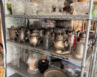 Vintage silver teapots and trays