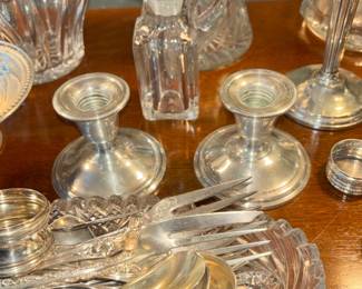 Multiple pieces of sterling silver candle holders