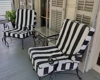 iron porch chairs with black and white cushions