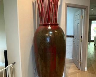Oversized Oxblood Ceramic Floor Vase Dramatic floor vase in a deep red/oxblood glaze, approximately 4 ft tall. Includes decorative bamboo stalks. A true room anchor.