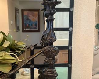 Baroque Candlestick Pair Matching pair of tall baroque-style candlesticks in a dark finish with decorative carved detailing. Sold as a pair.