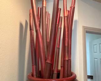 Oversized Oxblood Ceramic Floor Vase Dramatic floor vase in a deep red/oxblood glaze, approximately 4 ft tall. Includes decorative bamboo stalks. A true room anchor.