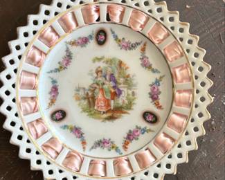 Decorative Porcelain Plate with Courting Couple Scene and Ribbon Accents