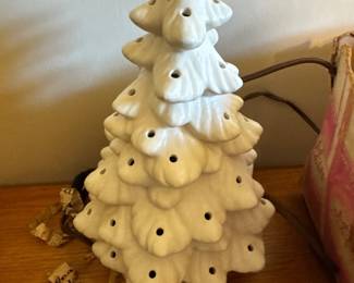 Ceramic Christmas tree on base. It does have the multi color bulbs. 