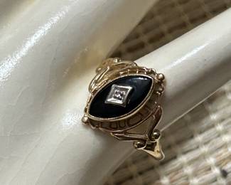 Gold and onyx ring