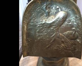 Close-up of shovel utensil with peacock