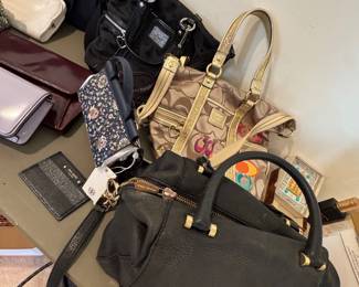 New and used designer purses.  New Tory Burch with tags attached.