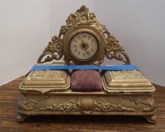 vintage clock with pin cushion and inkwell
