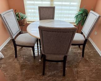 Walter E Smithe Marble top table and 4 upholstered studded chairs