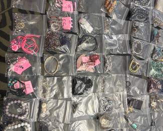Jewelry: earrings, bracelets, necklaces. Jewelry making supplies, jewelry display pieces, semi precious stones. Some priced individually some by lots.