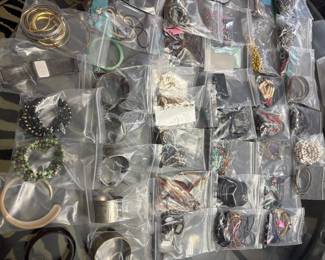 Jewelry: earrings, bracelets, necklaces. Jewelry making supplies, jewelry display pieces, semi precious stones. Some priced individually some by lots.