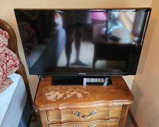 Thomasville nightstand and Samsung TV with remote
