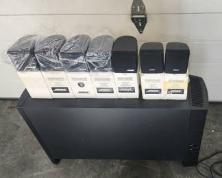 Lot 128: Bose Acoustimass Subwoofer & 7 Bose Acoustimass Cube Speakers