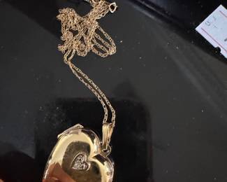 #30 - $235 - heart locket - 14kt yellow gold - 4.67 gr. size of a quarter or close to it.