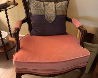#81 - $150 - French cane back armchair 27Wx18Dx36H salmon pillow 