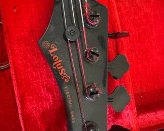 #30 - $350 - Lotus electric bass guitar in fitted case 