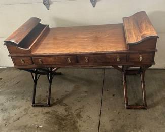 A exquisit Brandt writing table. Note - there are four 'normal' drawers and two 'hidden' compartments/drawers . One at each end of the table. One on the left is open and the one on the right is in the closed position.