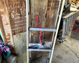 A two wheel utility cart with strap.