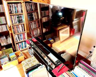 Flat Screen T.V. W/ Stand, CD's & DVD's And Shelving Units