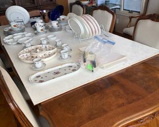 Dinning table with six chairs with. Rand new grey upholstered. Seats beautiful set White furniture company