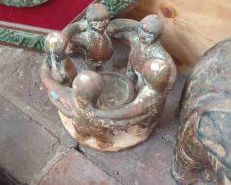 vintage Mexican clay pottery piece is a "Circle of Friends" sculpture and candle holder