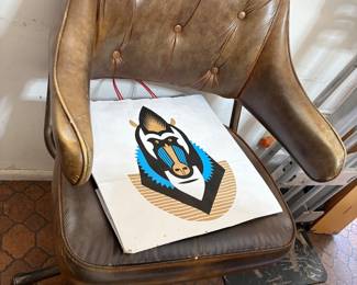 chair in the image appears to be a vintage Mid-Century Modern swivel chair