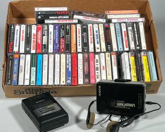 (3pc) LOT OF ASSORTED AUDIO CASSETTES WITH TWO SONY WALKMAN FM/AM CASSETTE PLAYERS