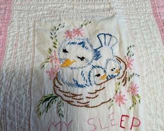 Close-up of hand work on baby quilt