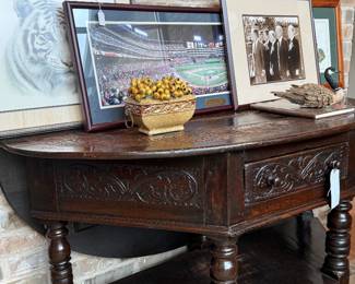 Drop leaf demilune carved table