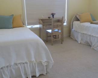 Twin bed set with full bedding.