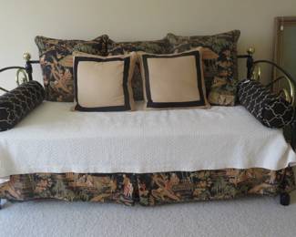 Fantastic black and brass trundle bed with complete bedding.