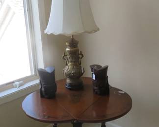 Antique drop leaf table with ivy decoration.