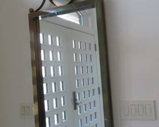 Stunning large antique copper wall mirror with round pediment.