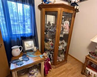 Collection of Porcelain Dolls in Display Cabinet