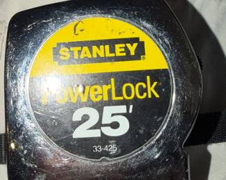 About a dozen measuring tapes