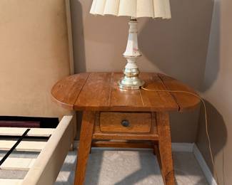 One of two matching bed stands and lamps