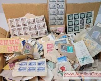 1 Thousands of Worldwide Stamps canceled on paper. Vintage