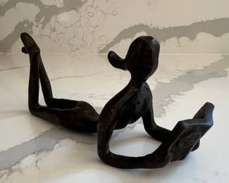Bronze Figure of a Reclining Person Reading