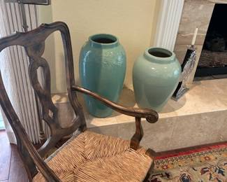 Woven rattan chair, brass lamp, blue pots