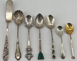 Assortment of sterling and 800 silver collectible spoons and butter knife