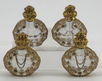Four vintage Czech glass perfume bottles with gold tone filigree