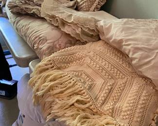 Assortment of linens, quilts etc