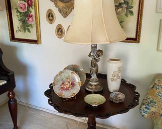 Mahogany carved round occasional table, matching set of Cherub lamps