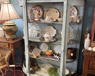 vintage curio cabinet, plates, platters, crocks, lamps